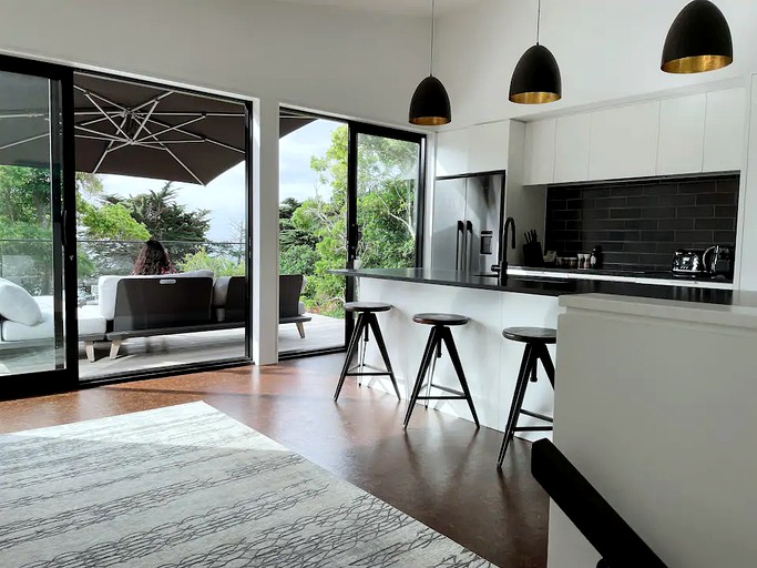 Go glamping in New Zealand at this beach house rental!