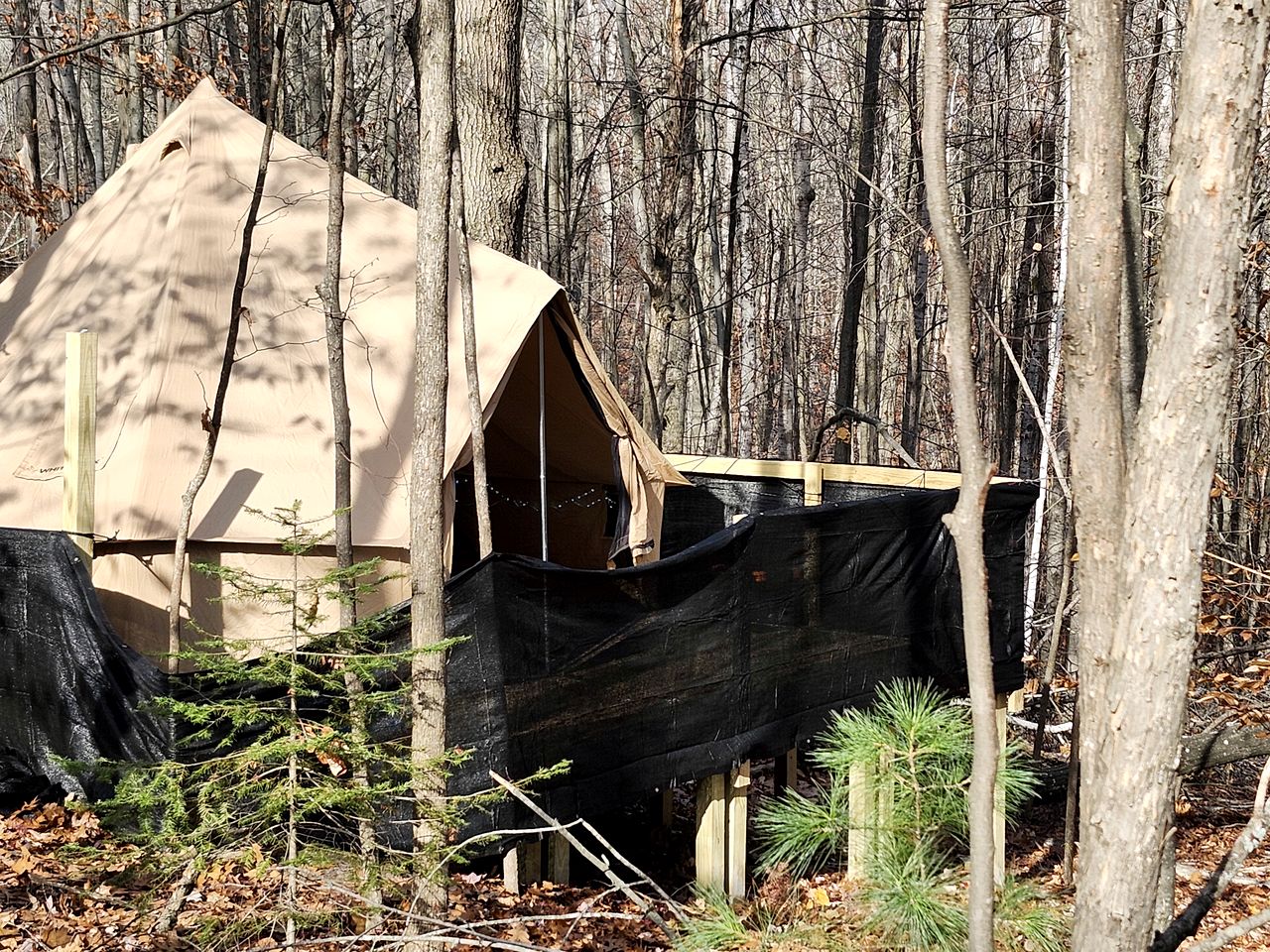 Cozy Bell Tent Glamping on Private Fenced Deck with Bathhouse Firepit WiFi and Trails in Mio, Michigan