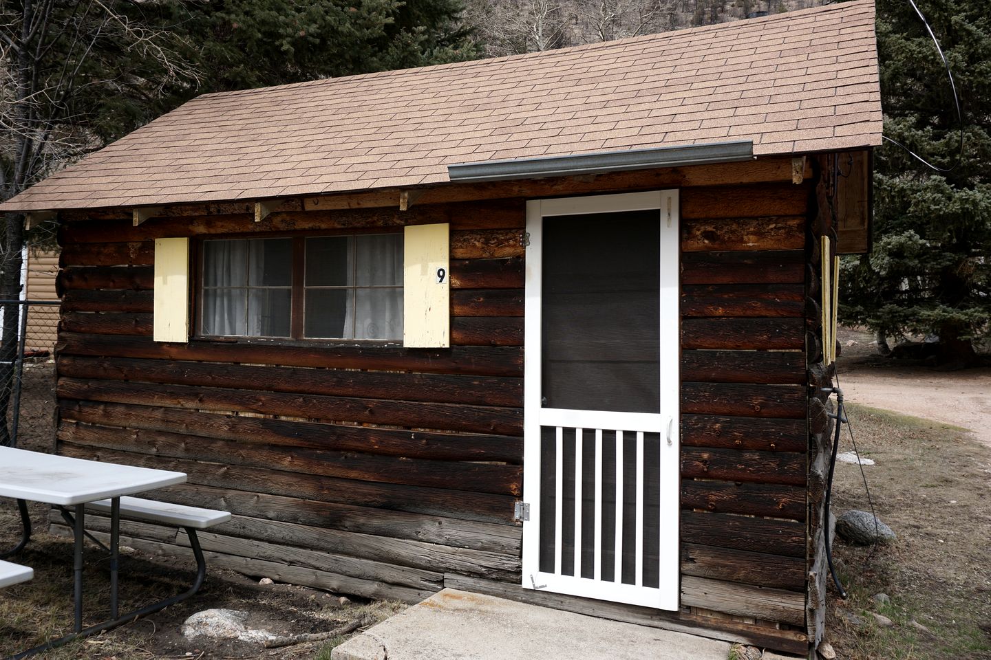 Simple Country Cabin with Ornate Wood Stove in the Colorado Mountains of Poudre Canyon