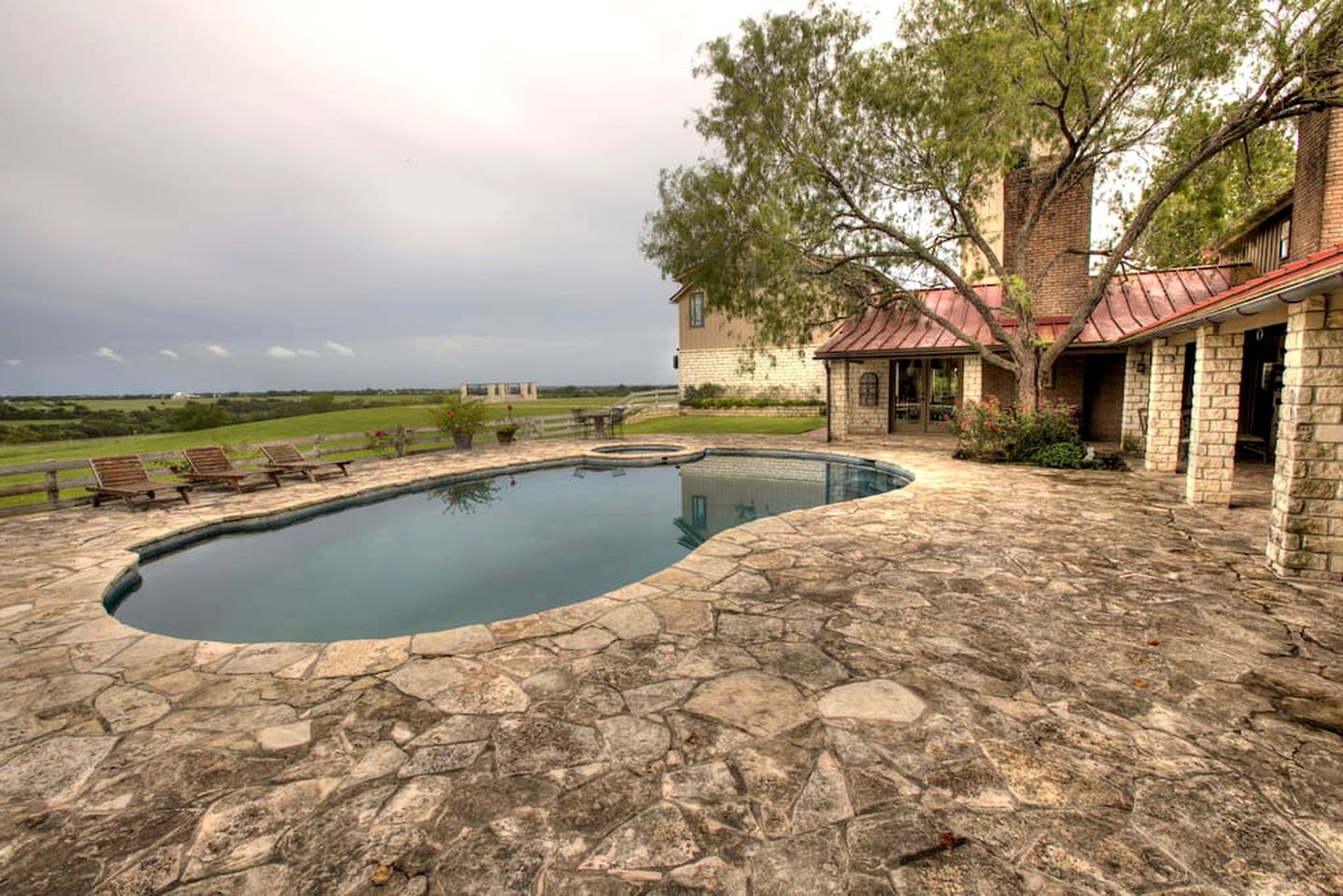 Luxury villa rental with private pool and stone patio on a ranch near Austin, TX.