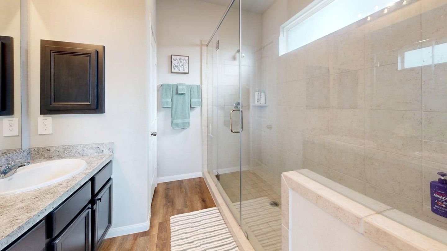 Serene Backyard Escape with Covered Porch in Bryan, Texas