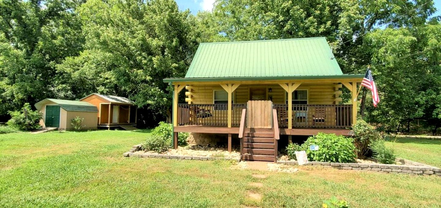 Elevate Your Tennessee Glamping Escape in this Lovely Riverside Cabin Rental in Newport