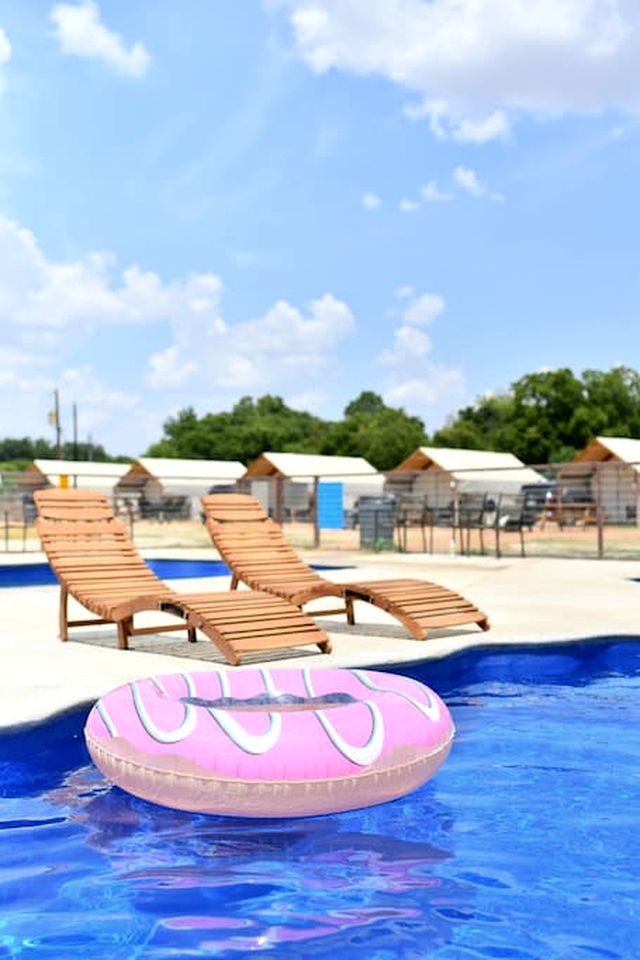 Deluxe Safari Tent Cabin with Creek Swimming, Fishing & Resort-Style Amenities in Marion, Texas