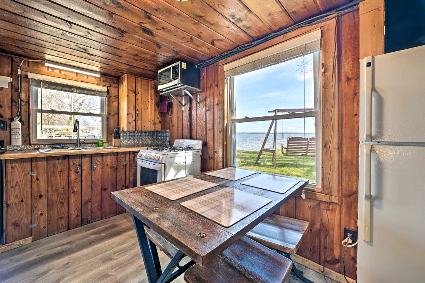 Cozy Lakeside Cabin with Dock & Fire Pit Access in Houghton Lake, Michigan