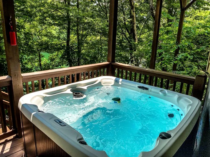 This Tennessee cabin with a hot tub at Norris Lake is the perfect nature getaway.