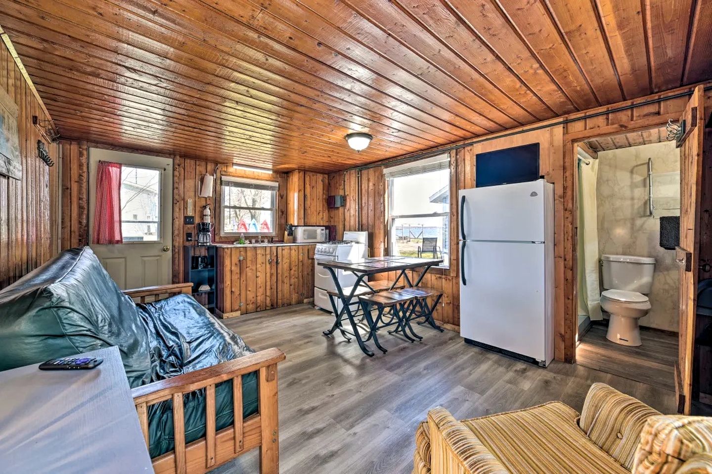 Pet-Friendly Lake Cabin with Dock & Kayaks & Fire Pit in Houghton Lake, Michigan