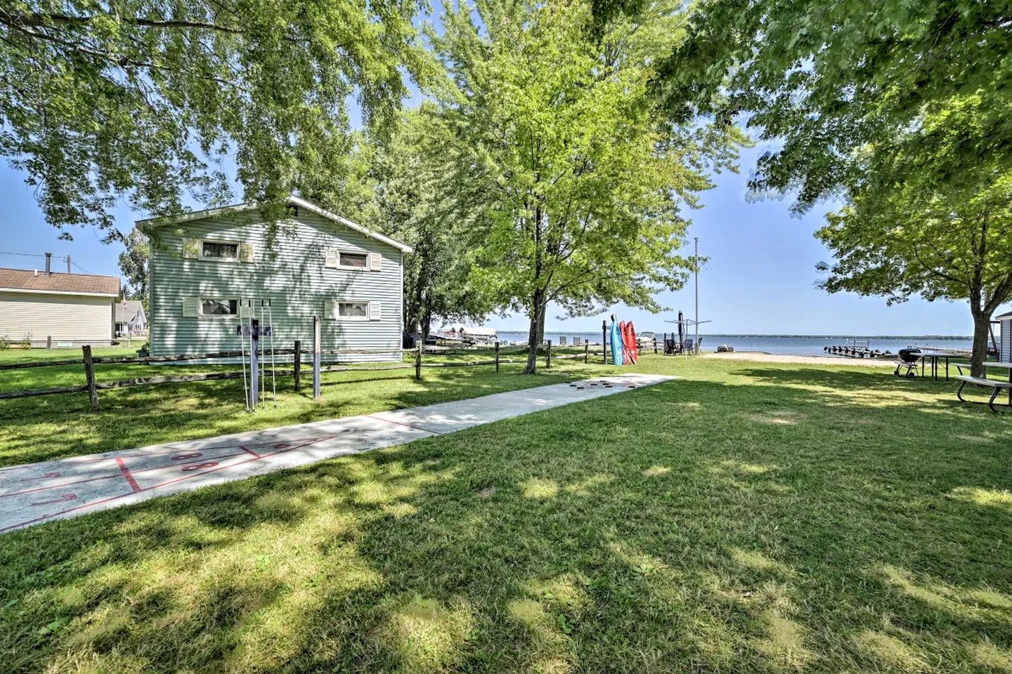 Waterfront Cabin with Kayaks, Dock & Fire Pit in Houghton Lake, Michigan