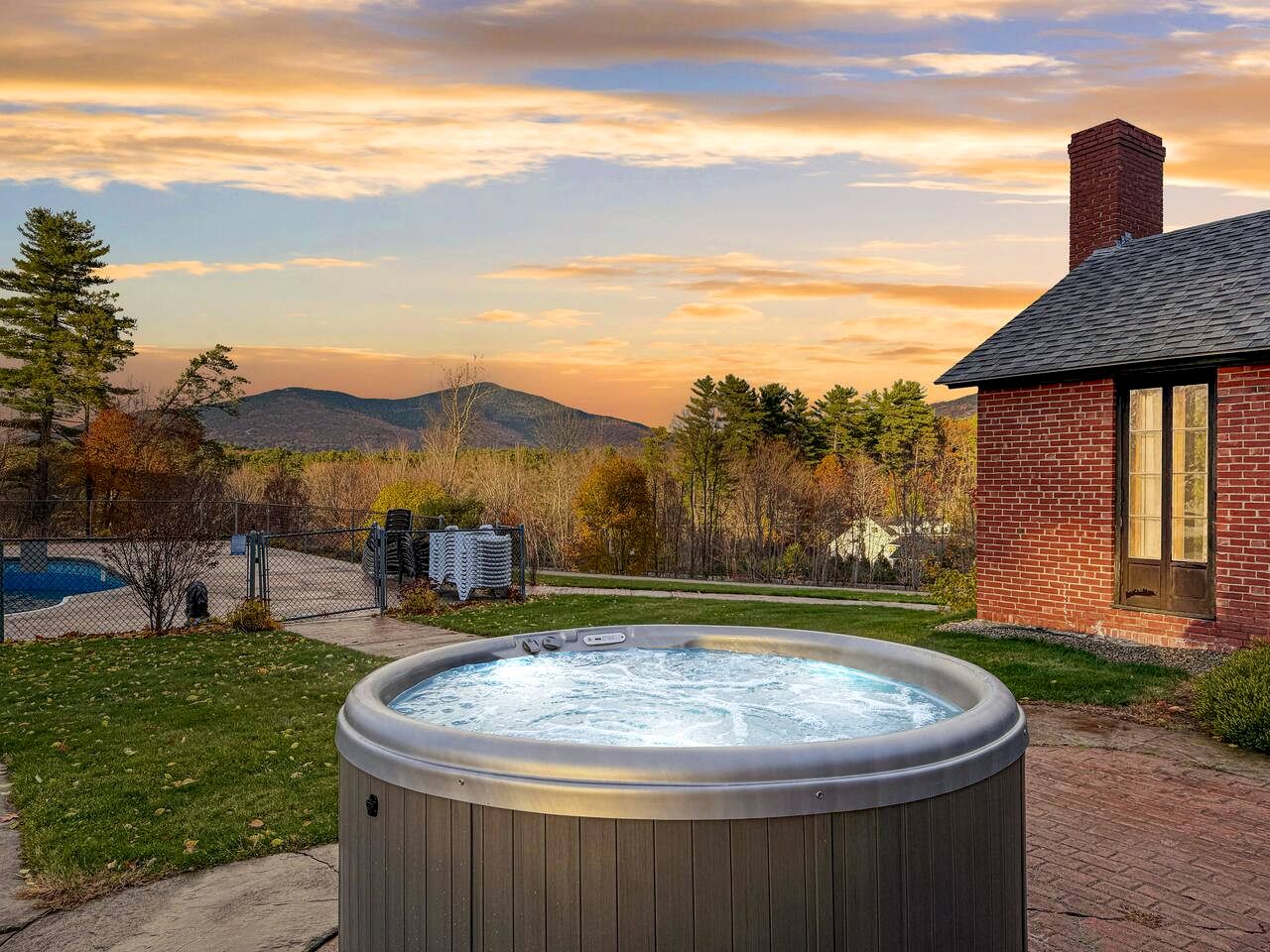 Charming Brick Retreat with Hot Tub & Mountain Views in Conway, New Hampshire