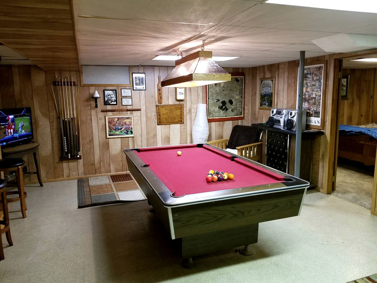 Secluded Lake Cottage Rental with a Dock and a Game Room in Hale, Michigan