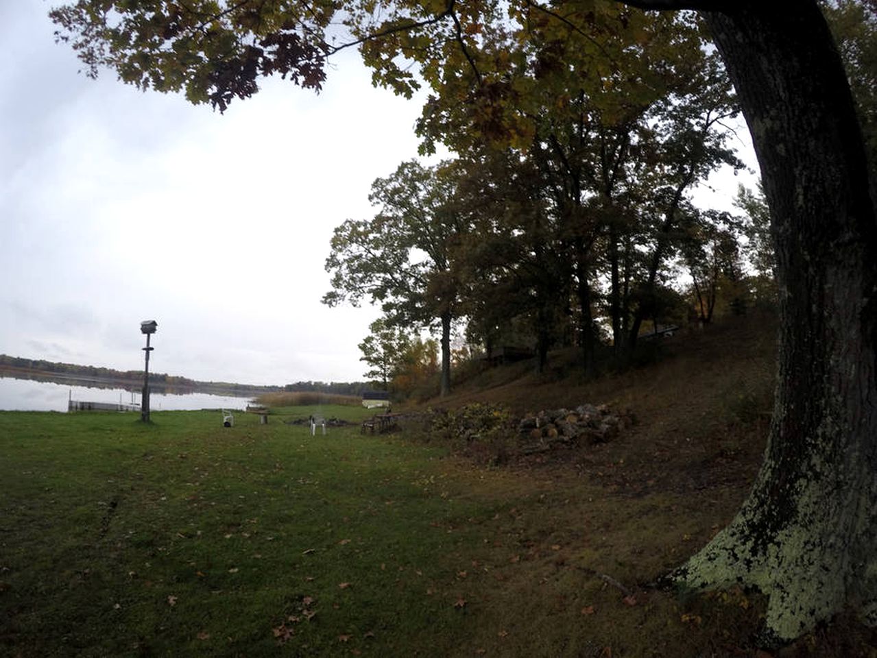 Secluded Lake Cottage Rental with a Dock and a Game Room in Hale, Michigan