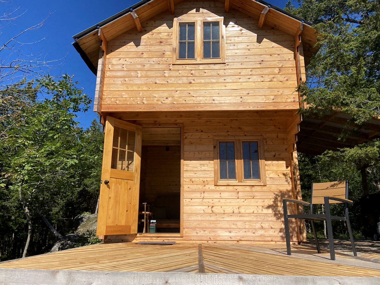 Cozy Off-Grid Cabin Surrounded by Trees with an Incredible View of Buck Lake in Perth Road, Ontario