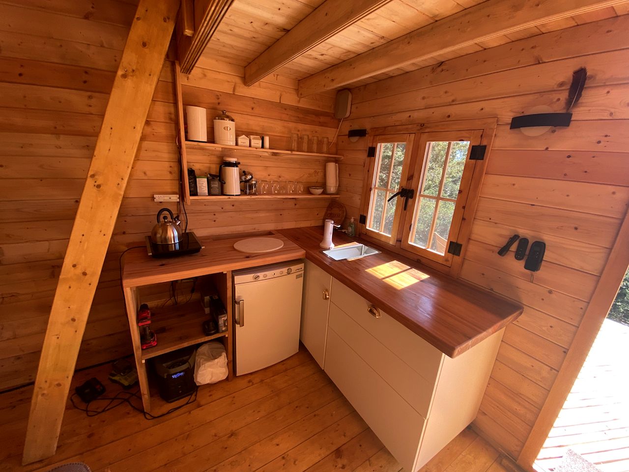 Cozy Off-Grid Cabin Surrounded by Trees with an Incredible View of Buck Lake in Perth Road, Ontario