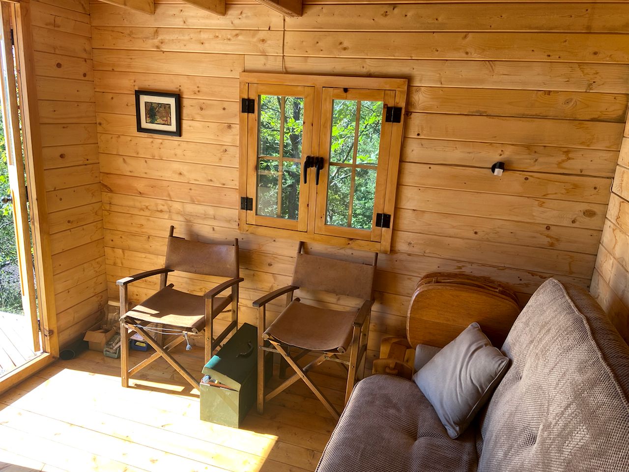 Cozy Off-Grid Cabin Surrounded by Trees with an Incredible View of Buck Lake in Perth Road, Ontario
