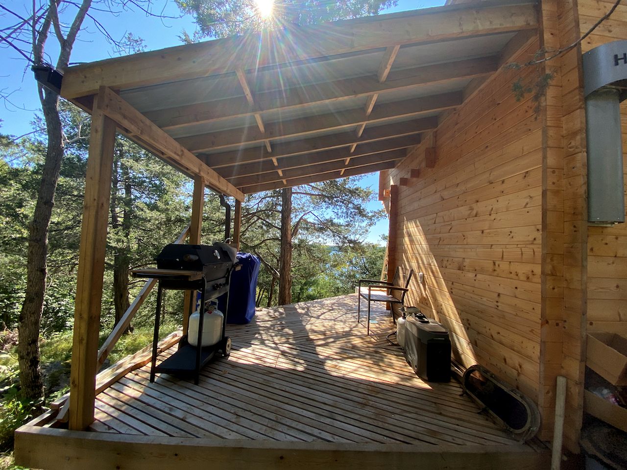 Cozy Off-Grid Cabin Surrounded by Trees with an Incredible View of Buck Lake in Perth Road, Ontario