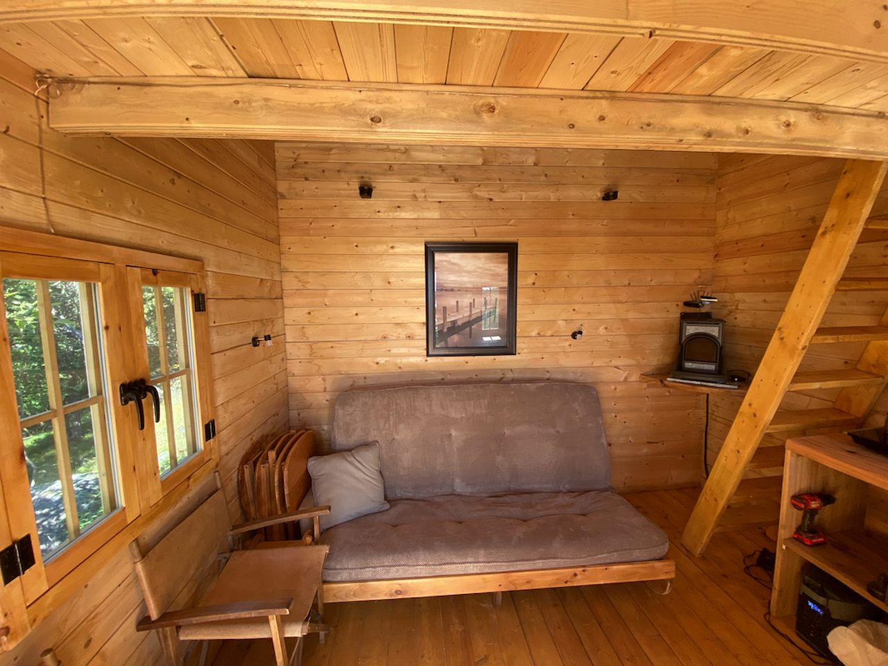 Cozy Off-Grid Cabin Surrounded by Trees with an Incredible View of Buck Lake in Perth Road, Ontario
