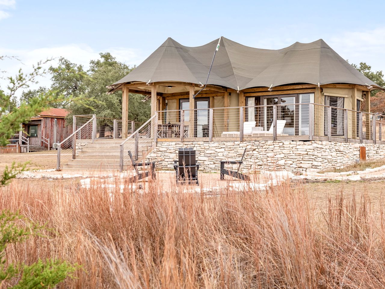 Luxurious Glamping Lodge with Wrap-Around Deck for an Amazing Getaway in Stonewall, Texas