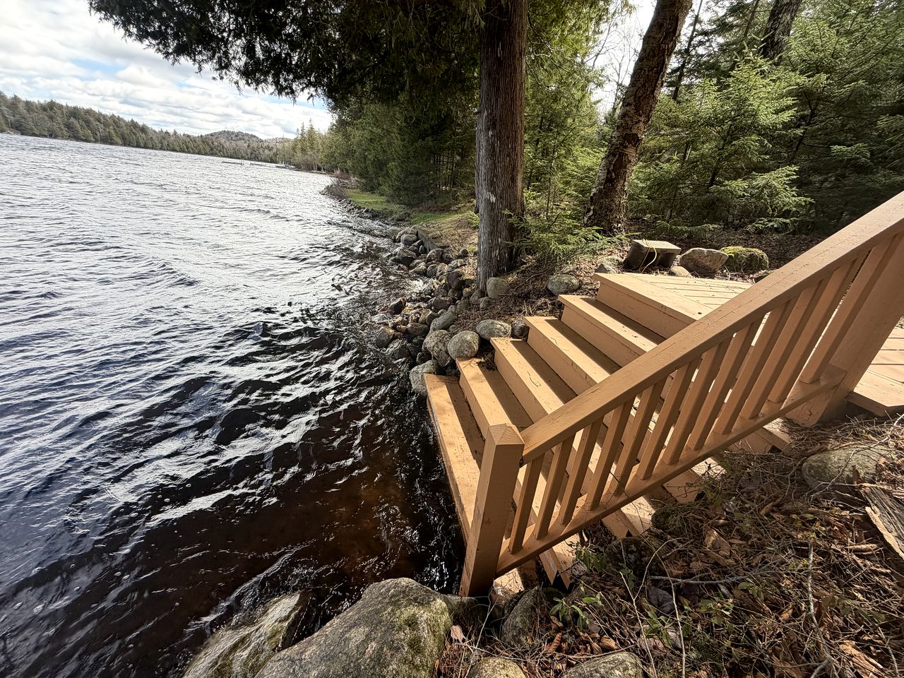 Cozy Cottage Surrounded by Trees with Private Dock for a Peaceful Escape by Big Moose Lake in New York