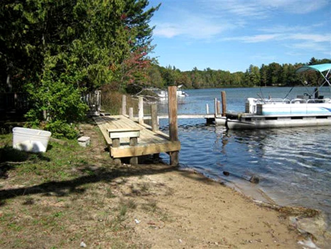 Blissful Lakeside Vacation Home with Pavilion and Dock near Woodland Park in Bitely, Michigan