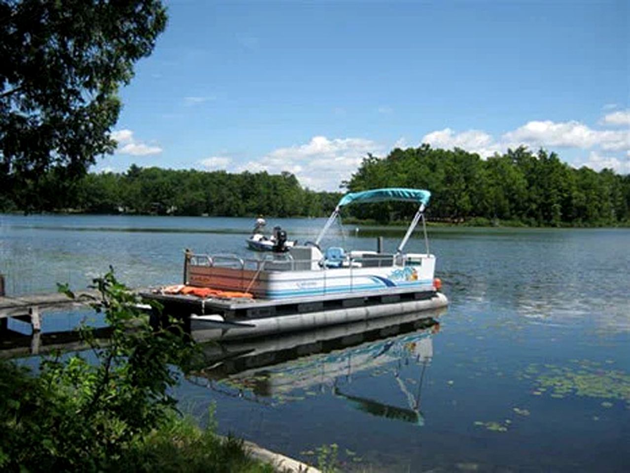 Blissful Lakeside Vacation Home with Pavilion and Dock near Woodland Park in Bitely, Michigan