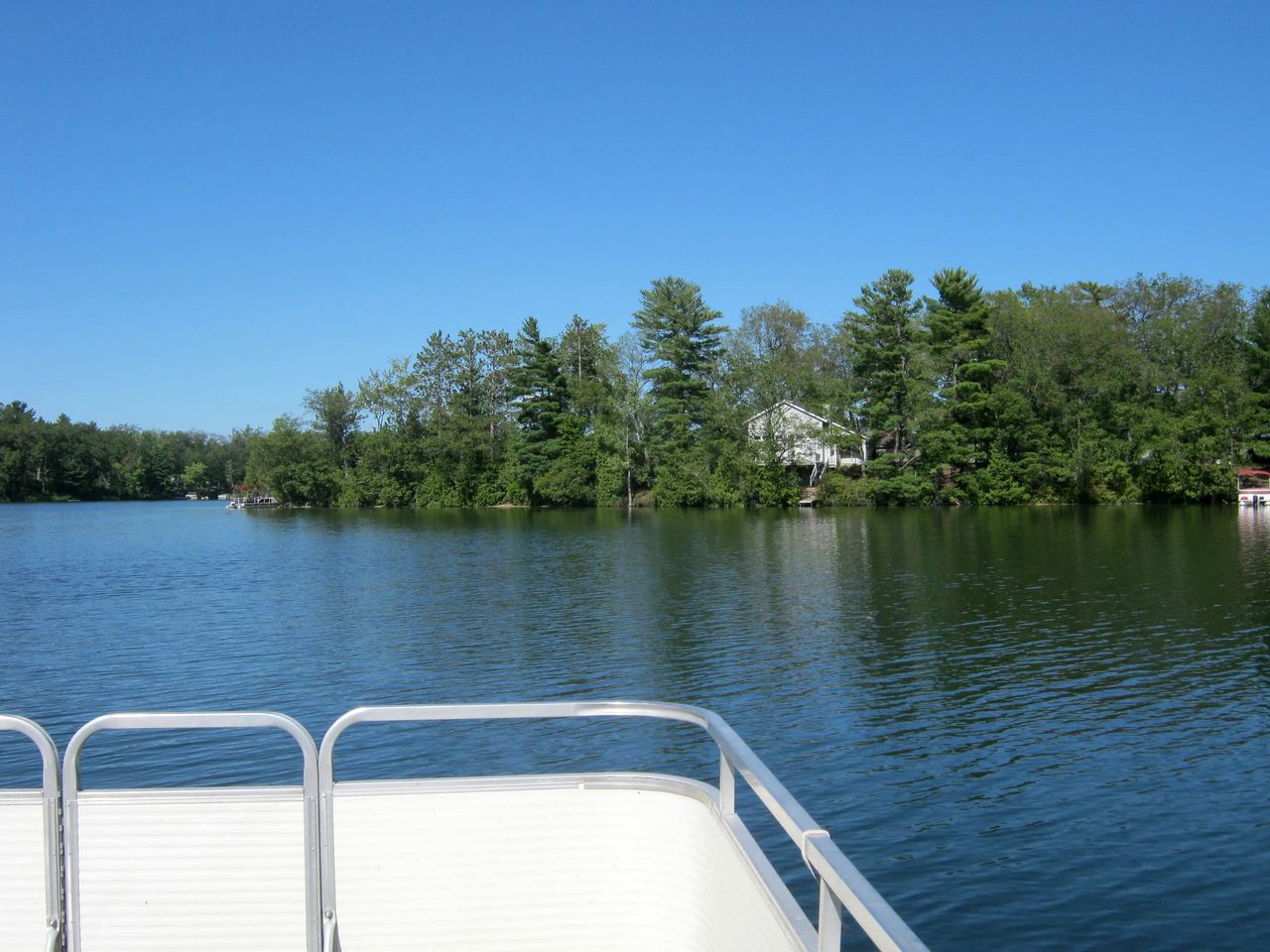 Blissful Lakeside Vacation Home with Pavilion and Dock near Woodland Park in Bitely, Michigan