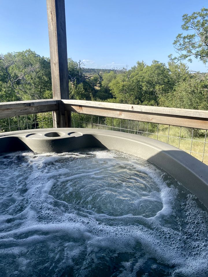 Beautiful Cabin with Deck and Hot Tub Overlooking Spring Creek in Texas