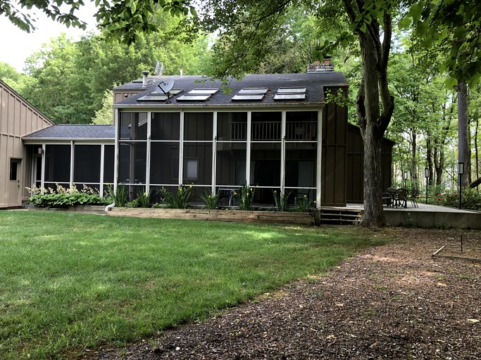 Secluded Woodland Retreat Home with Creekside Deck Near Macatawa Beach in Macatawa, Michigan