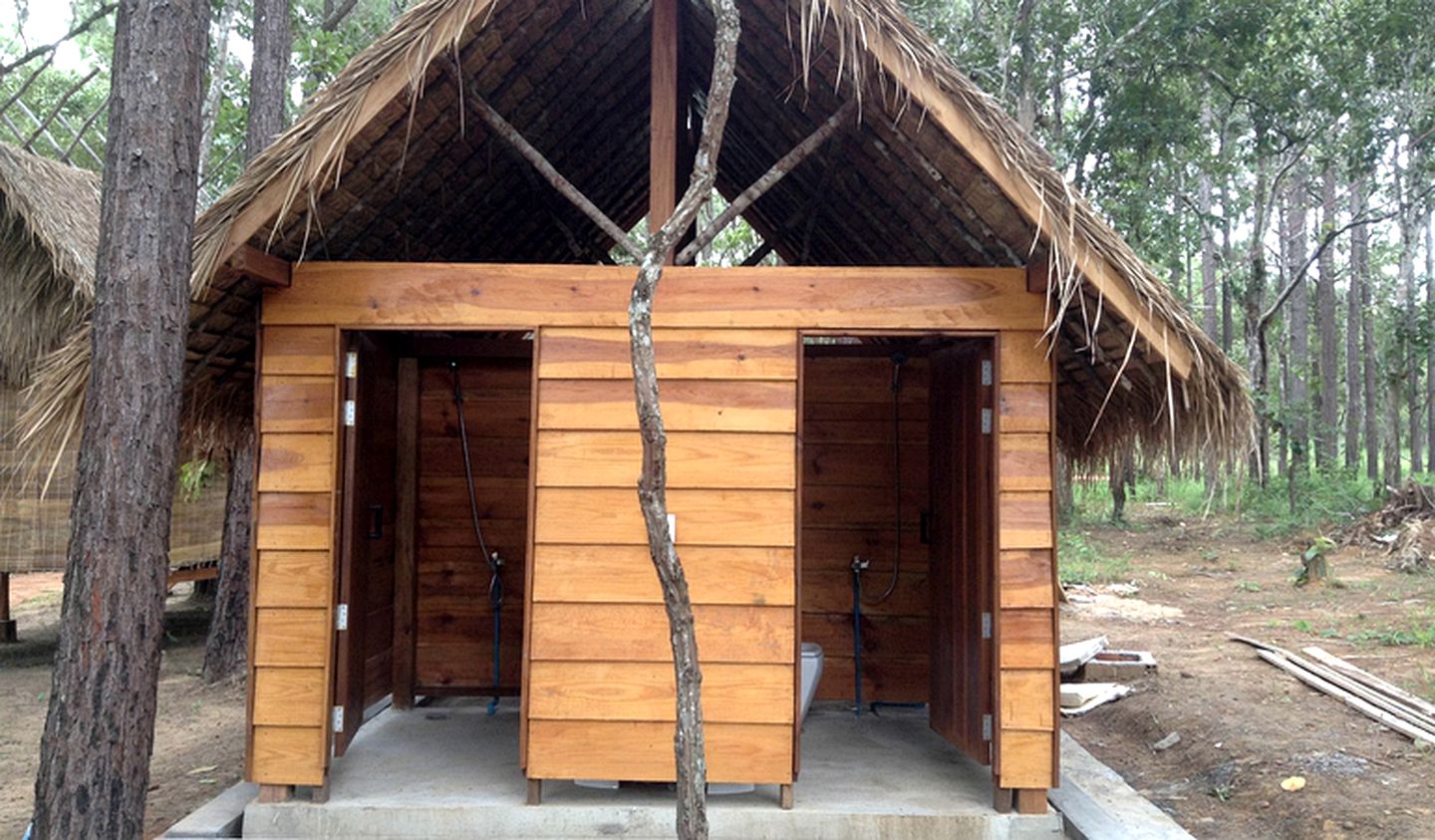 Authentic Elevated Hut Accommodations Surrounded by Trees in Cambodia