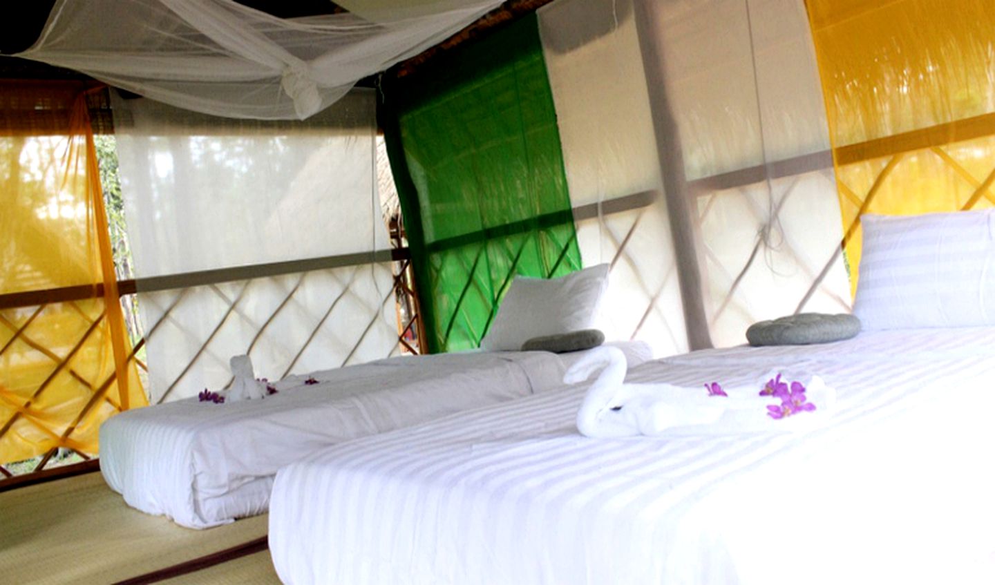 Authentic Elevated Hut Accommodations Surrounded by Trees in Cambodia
