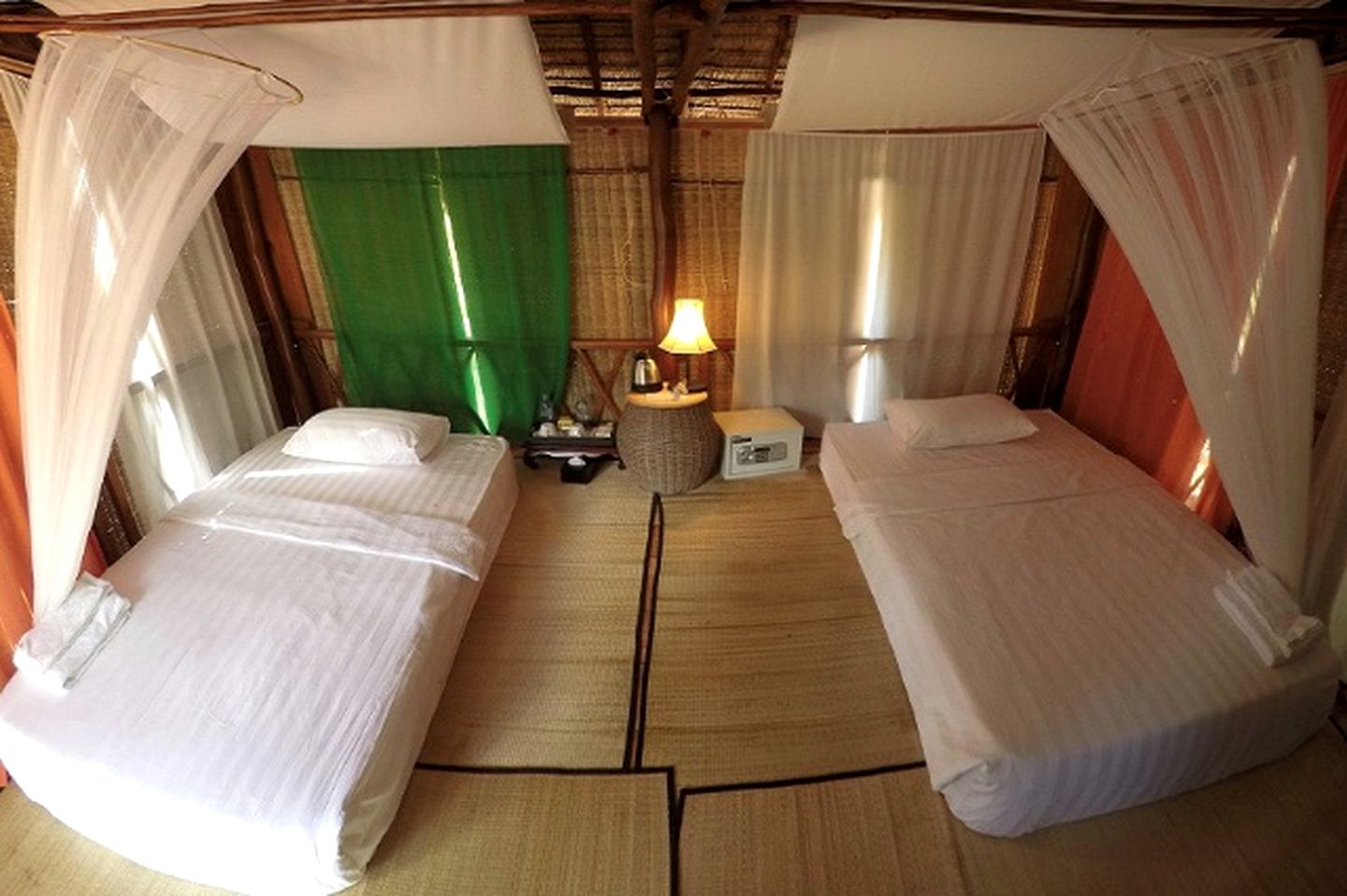 Authentic Elevated Hut Accommodations Surrounded by Trees in Cambodia