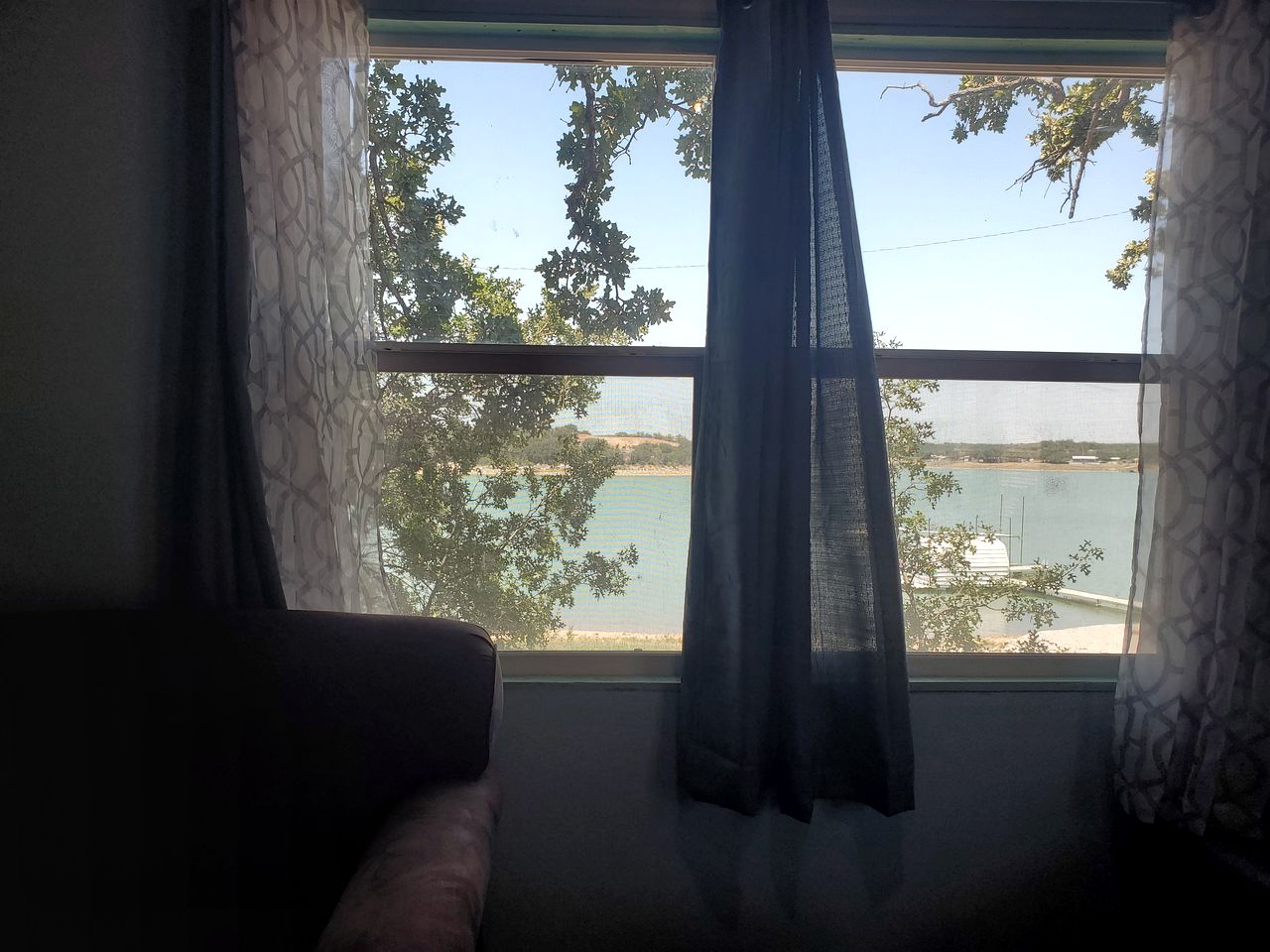 Charming Lakefront Cabin with Sandy Beach Access & Fire Pit Near Lake Cisco, TX