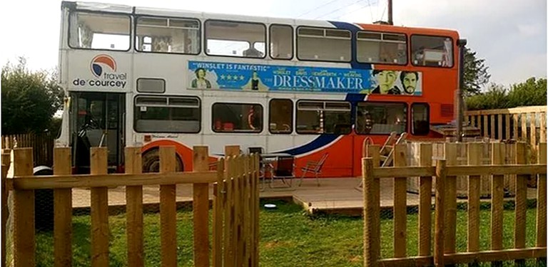 Double-decker tourist bus converted into a holiday rental in Shropshire, England.