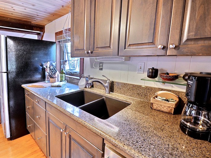 Sink area of a kitchen in a Brighton log cabin.