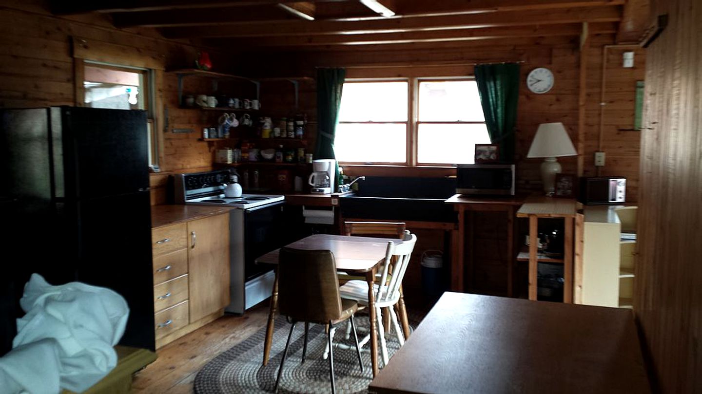 Rustic Camping Cabin with Fireplace in Private Woods near Bangor, Maine