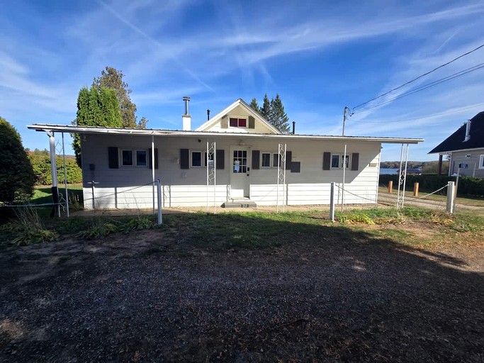 Peaceful Waterfront Chalet with Private Dock and Mountain Views near Chénéville, QC