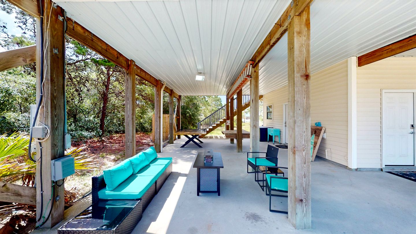 Charming Beachside Home with Private Patio & Dog-Friendly Policy near Surfside Shores, Gulf Shores, AL