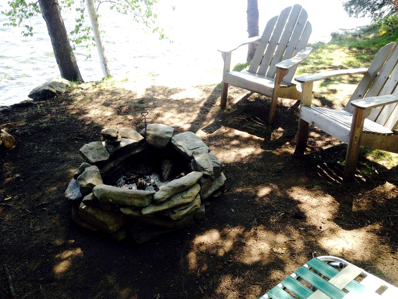 Charming Lakefront Cabin Rental with a Fire Pit near Brownville, Maine