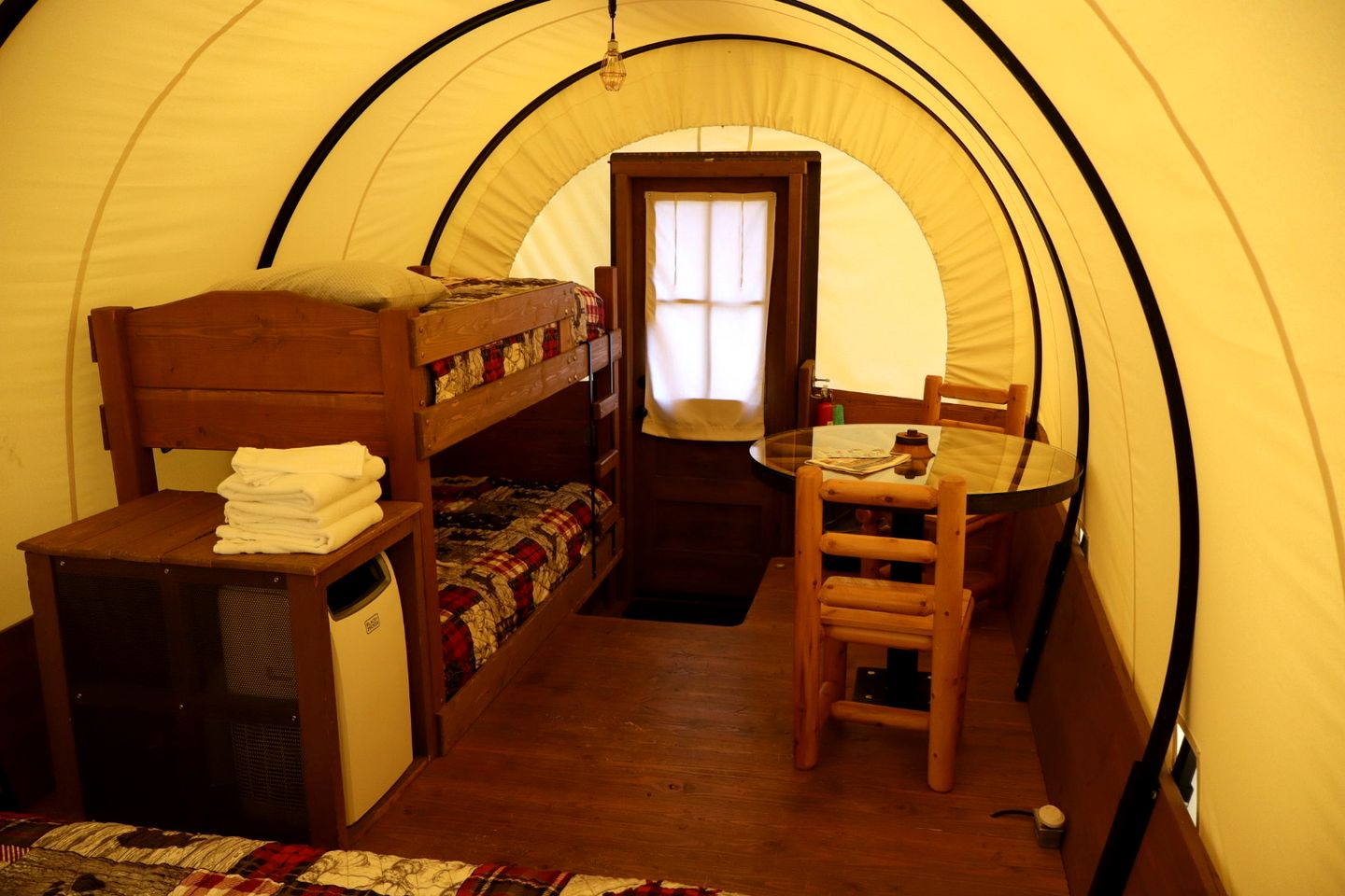 Rustic Conestoga Wagon Stay with Lodge Amenities near Boulder Creek, Montana