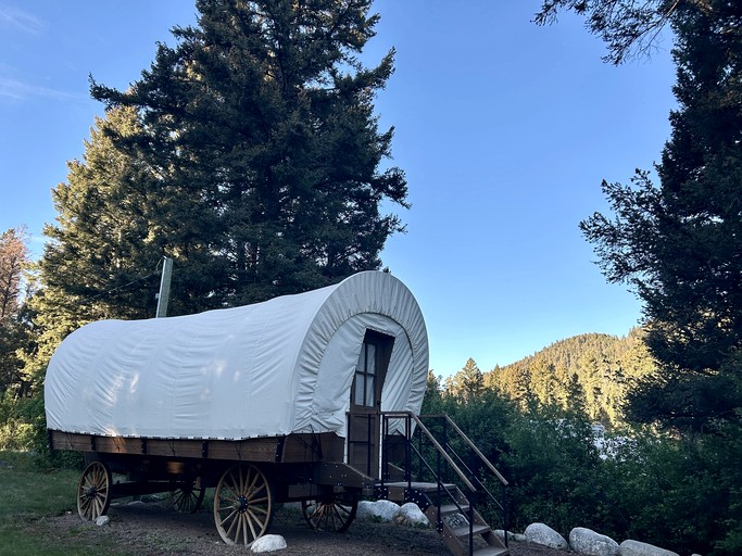 Rustic Conestoga Wagon Stay with Lodge Amenities near Boulder Creek, Montana