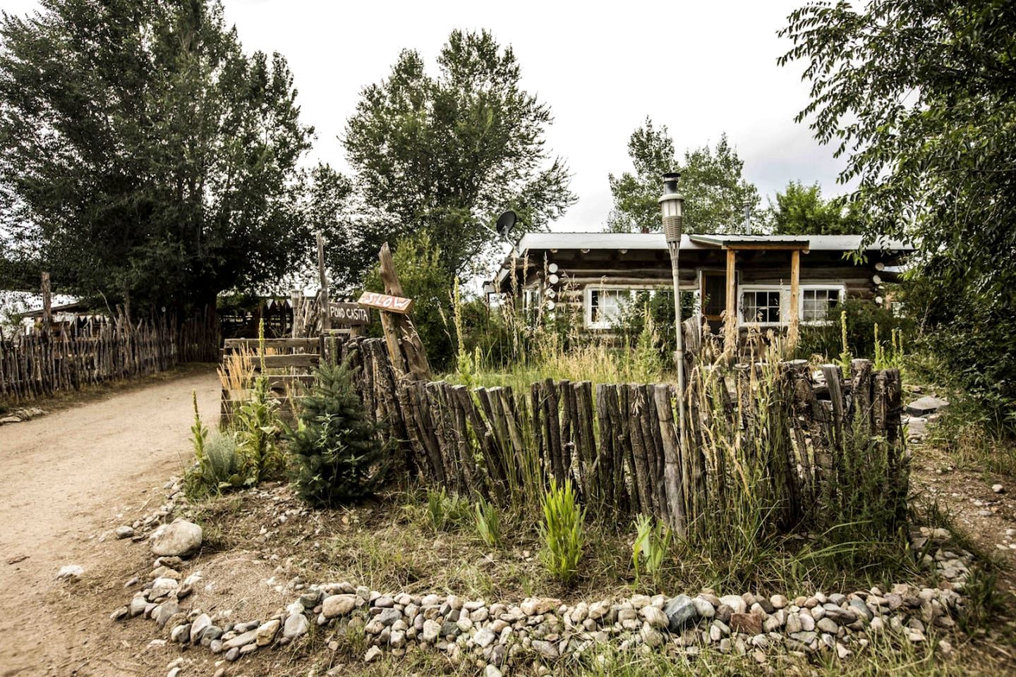 Log Casita Overlooking Pond and Waterfall near Taos, New Mexico