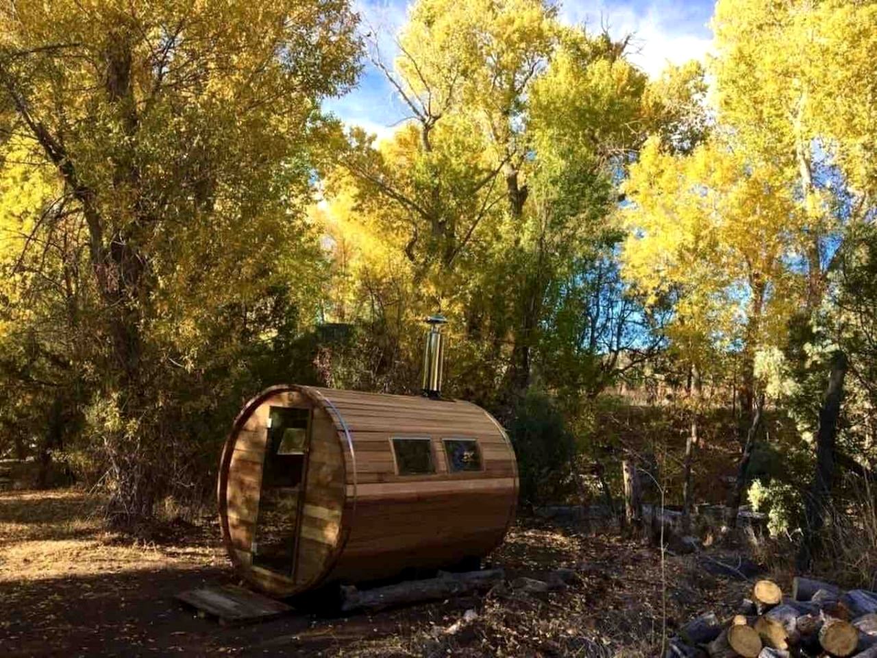 Log Casita Overlooking Pond and Waterfall near Taos, New Mexico