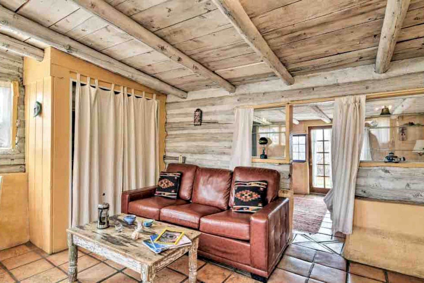 Log Casita Overlooking Pond and Waterfall near Taos, New Mexico