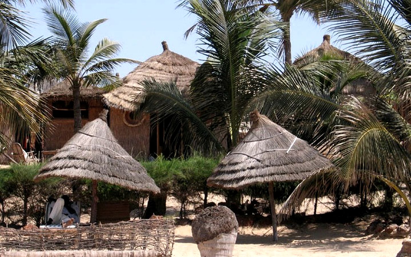 Elegant Beachside Huts near a Vibrant Port Town in Senegal, Africa