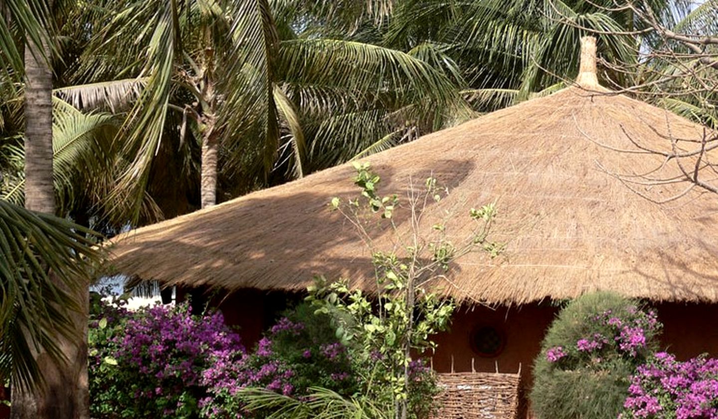 Elegant Beachside Huts near a Vibrant Port Town in Senegal, Africa