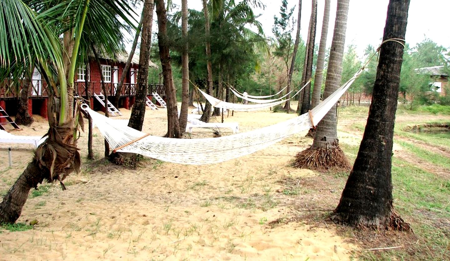 Elevated Thatched Cabins on Beach Village Resort, India