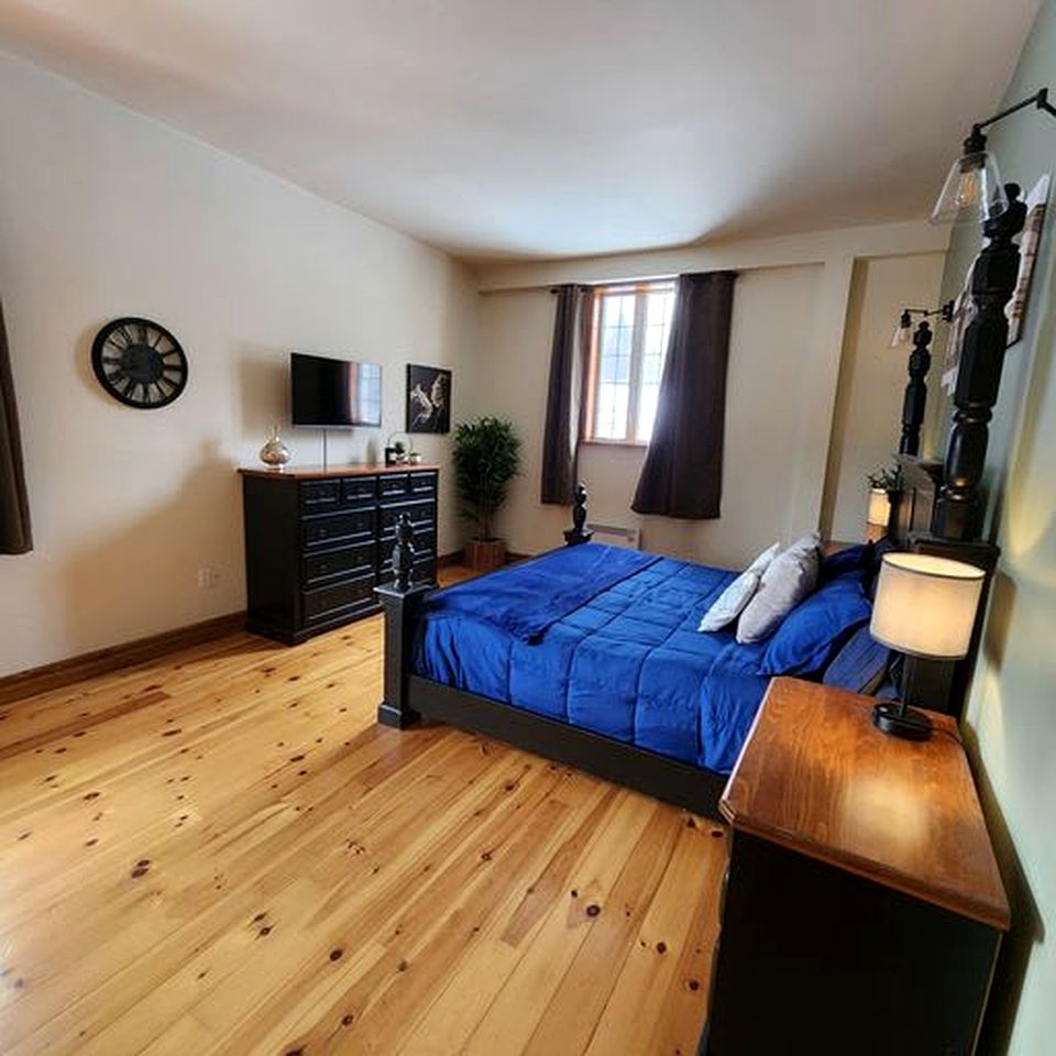 Enormous Lakefront Villa with Interior Pool, Game Room and Gym Space in Lac des Plages, Quebec