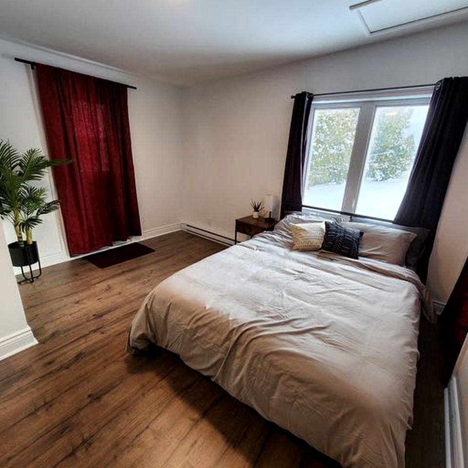 Enormous Lakefront Villa with Interior Pool, Game Room and Gym Space in Lac des Plages, Quebec