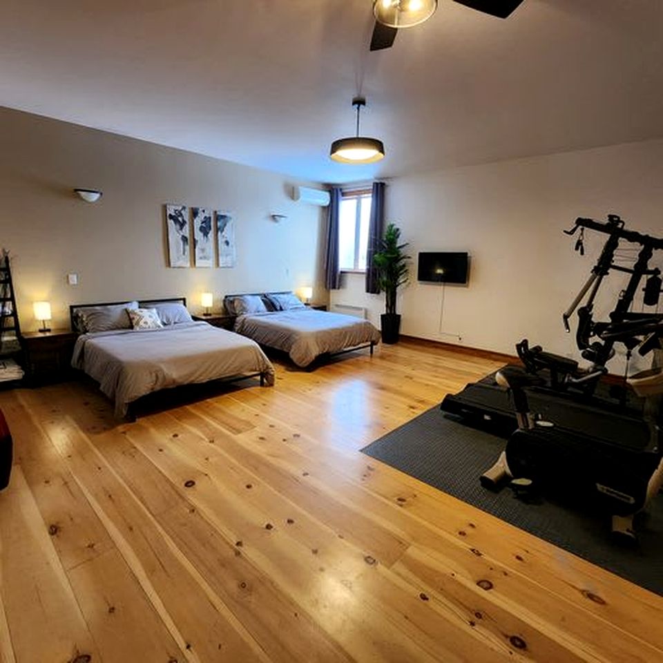 Enormous Lakefront Villa with Interior Pool, Game Room and Gym Space in Lac des Plages, Quebec