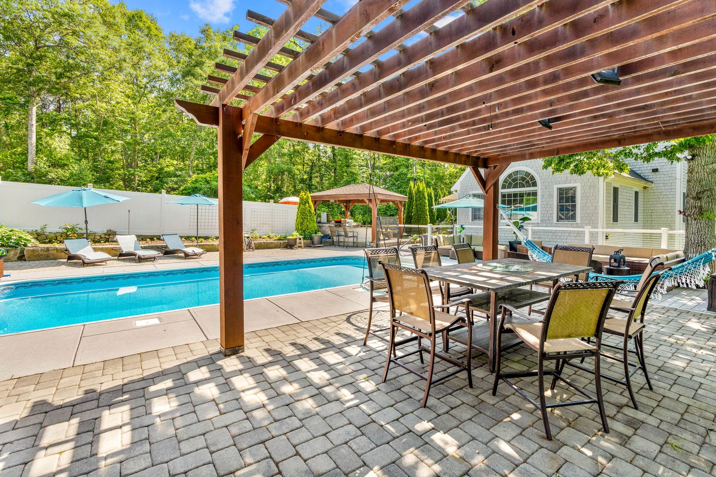 Elegant Coastal Retreat with Heated Pool, Firepit & Game Room Near Cape Cod Beaches | Barnstable, Massachusetts