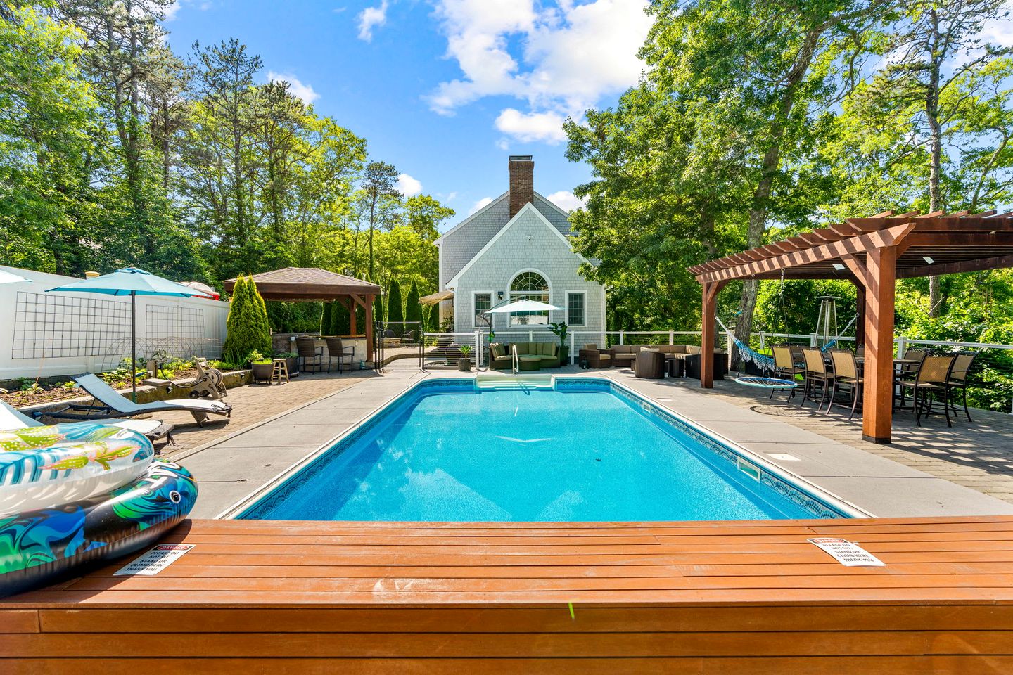 Elegant Coastal Retreat with Heated Pool, Firepit & Game Room Near Cape Cod Beaches | Barnstable, Massachusetts