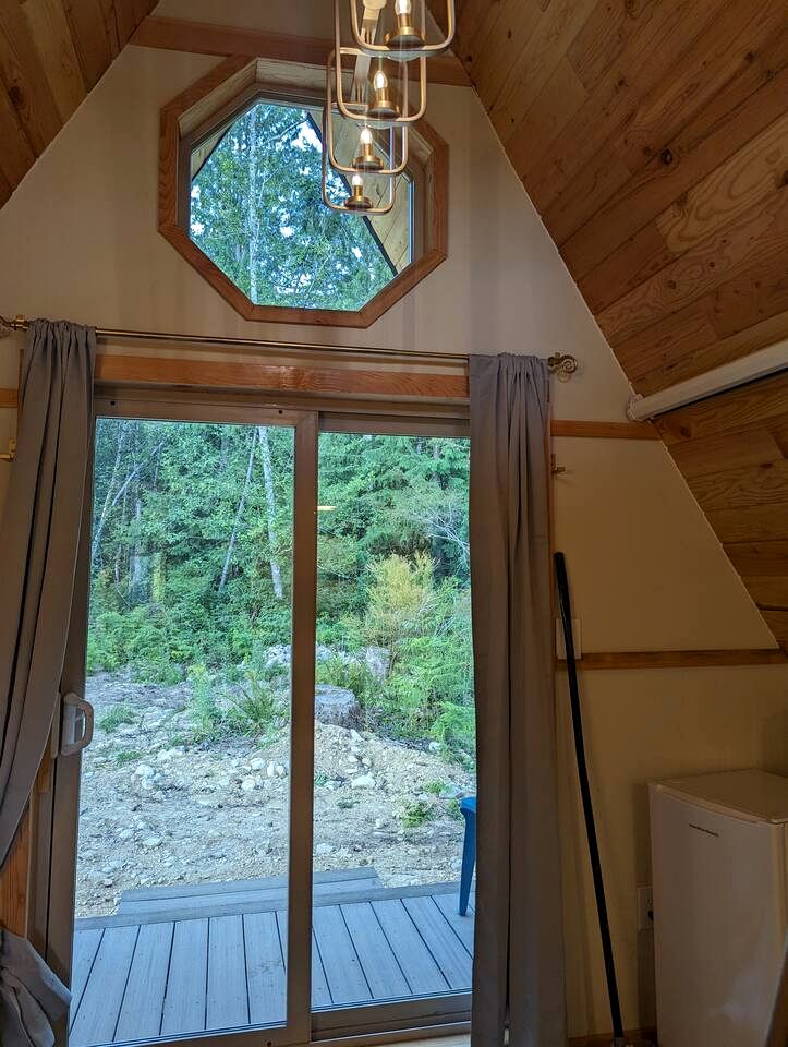 Romantic Golden Tree Ring Cabin with Forest Views & Egg Tub near Homestead Farm in British Columbia